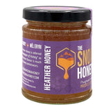 Jar of Heather Honey with a purple label on a white background